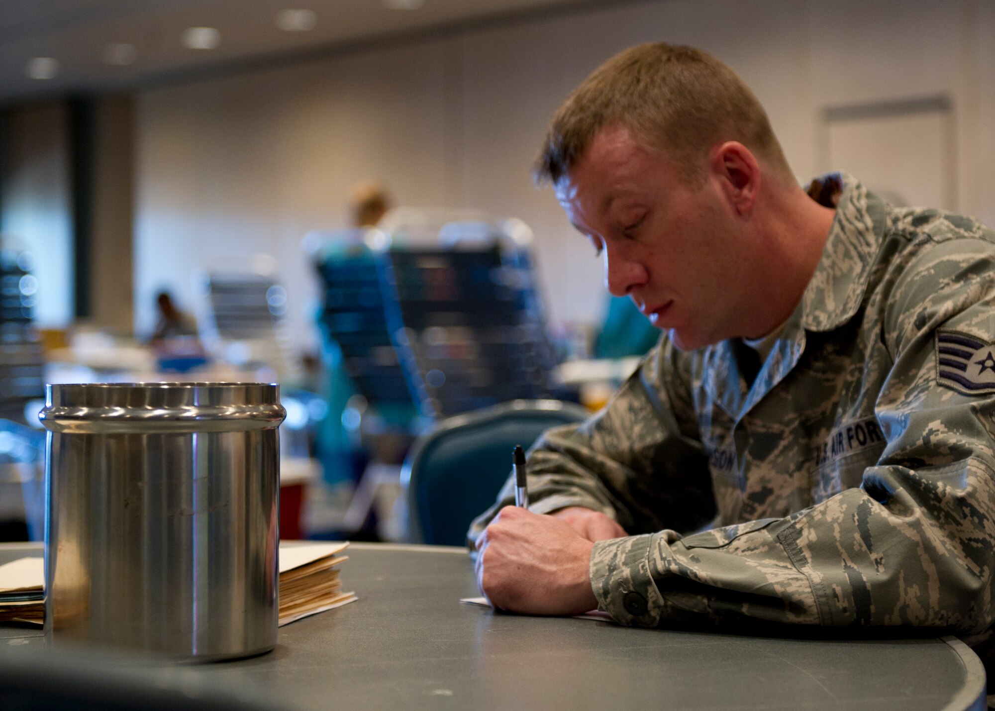 Staff Sgt. Jeffrey Lawson, 49th Materiel Maintenance Squadron unit deployment manager, fills out a blood donation record during an Armed Services Blood Program blood drive at Holloman Air Force Base, N.M., Feb. 20. The ASBP provides blood products for service members and their families. (U.S. Air Force photo by Senior Airman Kasey Close/Released)