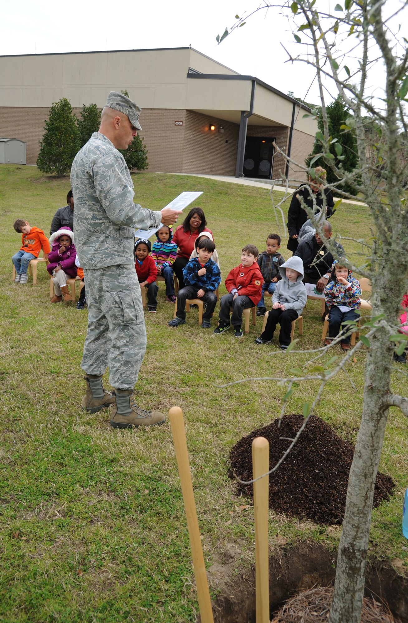 Brig. Gen. Brad Spacy, 81st Training Wing commander, reads the Arbor Day proclamation to a 4-to-5-year-old class at the child development center Feb. 21, 2013, at Keesler Air Force Base, Miss., prior to a tree planting ceremony in honor of Arbor Day.  The Tree City USA award was also presented to Keesler for the 20th consecutive year for its tree management program.  (U.S. Air Force photo by Kemberly Groue)