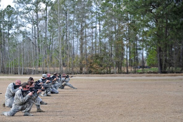 Members of the 1st Combat Camera Squadron participate in a live-fire training exercise during Threat Management Group's Advanced Weapons and Tactics Training in Charleston, S.C. The two-week training focuses on marksmanship fundamentals, integrated with shoot-move-and-communicate training, as well as land navigation and patrolling elements. (U.S. Air Force photo by Airman 1st Class Alexandra Minor)