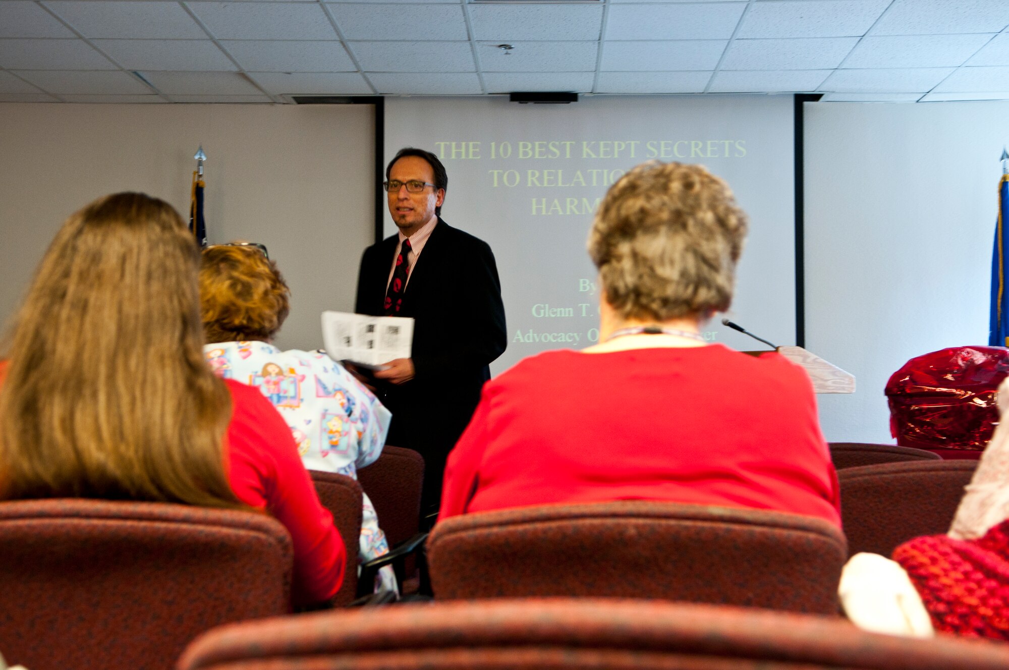 Glenn Garcia, 90th Medical Group Outreach Program manager, speaks to the crowd attending the Women’s Heart Health Fair about mental health issues affecting heart health. (U.S. Air Force photo by Airman 1st Class Jason Wiese)