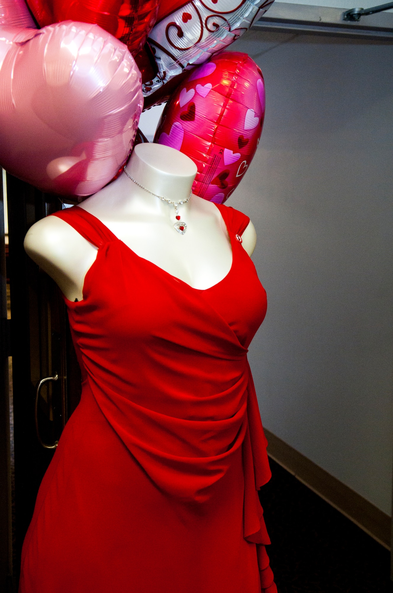 A mannequin wearing a red dress marks the entrance to the Women’s Heart Health Fair. (U.S. Air Force photo by Airman 1st Class Jason Wiese)