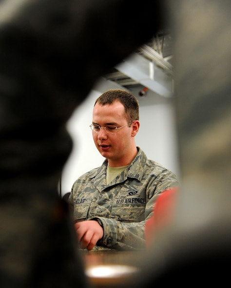 Airman 1st Class Kyle Sinclair, 341st Civil Engineer Squadron power production apprentice, discusses ideal leadership traits with his peers during the ?Continue to Rise: Arise as a Leader? Airman development seminar Feb. 12 in the conference room in Bldg. 3080. Airmen in attendance were broken into three teams and charged with developing their own leadership style to be presented to a senior noncommissioned officer panel. (U.S. Air Force photo/Staff Sgt. R.J. Biermann) 