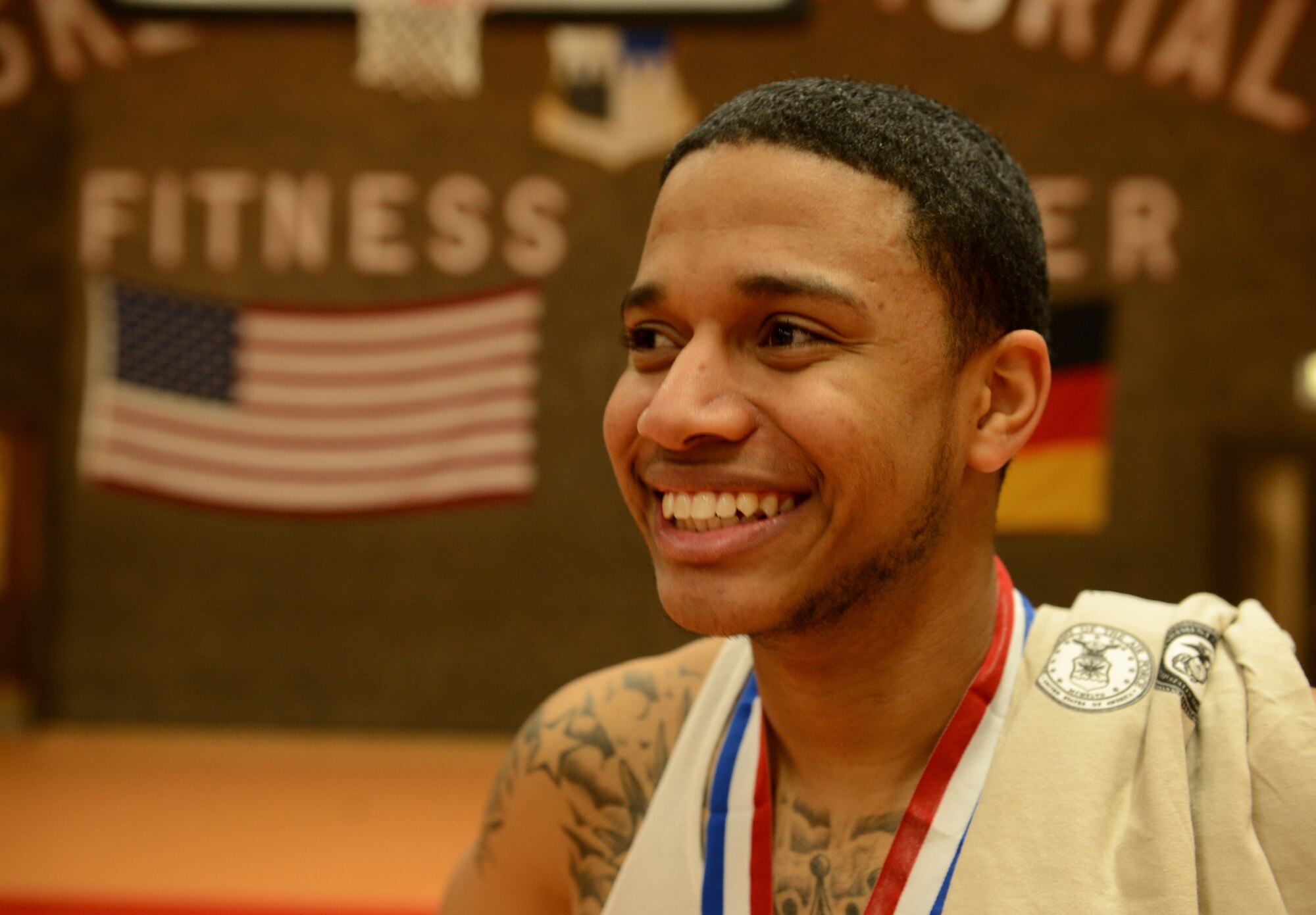 SPANGDAHLEM AIR BASE, Germany – Krystofer Benson smiles after the intramural basketball championship game Feb. 21, 2013. Benson, who is from the 702nd Munitions Support Squadron, Buechel Air Base, played for the 52nd Logistics Readiness Squadron as part of a players pool, which allows players to fill gaps in other units’ lineups. (U.S. Air Force photo by Staff Sgt. Nathanael Callon/Released)
