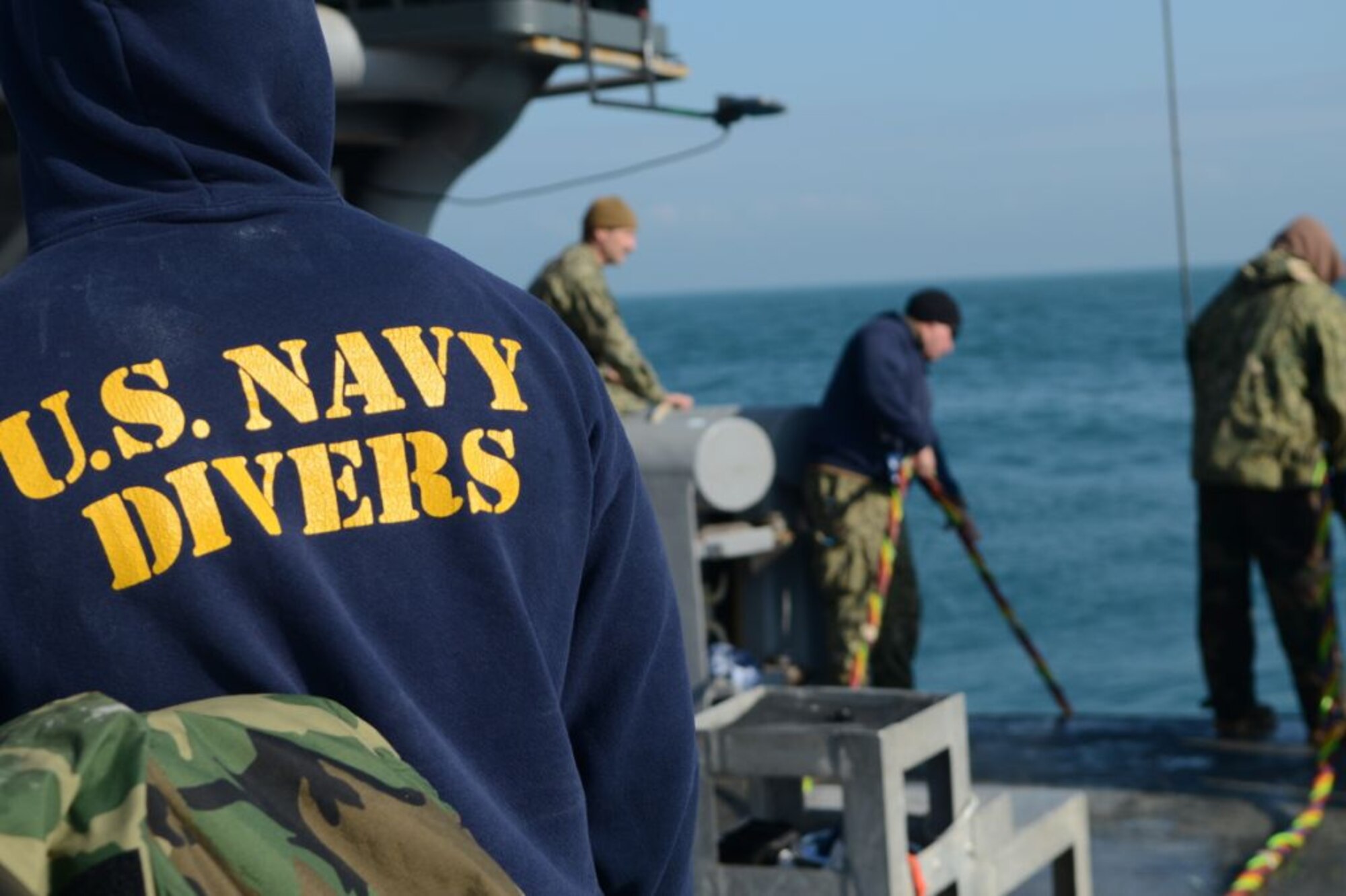 U.S. Navy divers perform a surface supply dive in the Adriatic Sea from the salvage vessel USNS Grapple (T-ARS 53), Feb. 14, 2013. Navy divers from the Mobile Diving Salvage Unit 2, Company 4, are performing deep sea salvage operations from the Grapple to help find wreckage from an F-16 Fighting Falcon which crashed in the Adriatic Sea, Jan. 28.  (U.S. Air Force photo by Staff Sgt. Evelyn Chavez/Released)