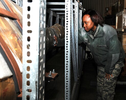 Staff Sgt. Zsane Wrice, 100th Logistics Readiness Squadron Mobility Readiness Spares Package supervisor from St. Louis, Mo., checks a piece of equipment Feb. 19, 2013, at RAF Mildenhall, England. The MRSP’s personnel inventory, replenish and prepare parts to deploy from a home station to other locations. (U.S. Air Force photo by Gina Randall/Released)