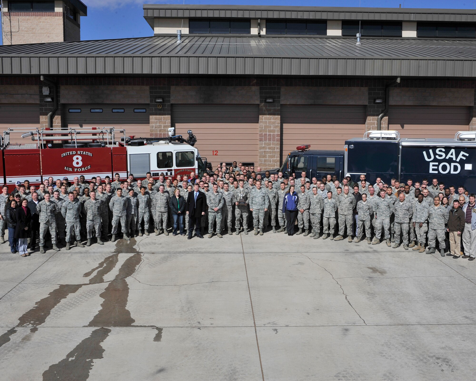 Members of the 27th Special Operations Civil Engineer Squadron stand with Maj. Gen. Timothy A. Byers, Air Force Civil Engineer, after being presented with the Air Force’s Outstanding Civil Engineer Unit Award at Cannon Air Force Base, N.M., Feb. 11, 2013. The 27 SOCES is credited in executing the largest military contracting program for 2012, estimated at $1.29 billion. (U.S. Air Force photo/Senior Airman James Bell) 