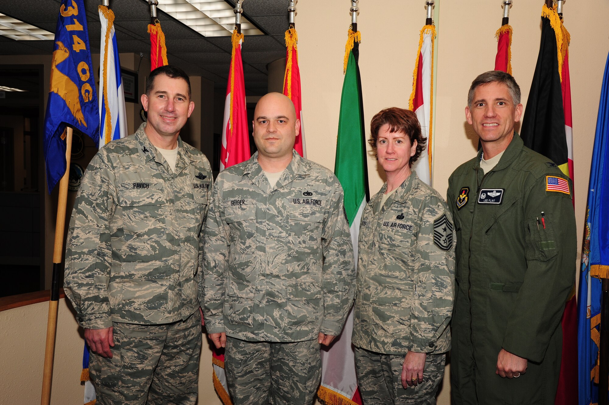 Master Sgt. Timothy Geiger (second from the left), 714th Training Squadron noncommissioned officer in charge of international students, is recognized as the Combat Airlifter of the Week Feb. 12, 2013, by Col. Todd Pavich (far left), 314th Airlift Wing vice commander, Chief Master Sgt. Andrea Gates, 314th AW command chief master sergeant and Col. Lee Flint, 314th Operations Group commnander. Gieger was recognized among his peers for his distinguished work as NCOIC of the international students on base. (U.S. Air Force photo by Airman 1st Class Kaylee Clark)