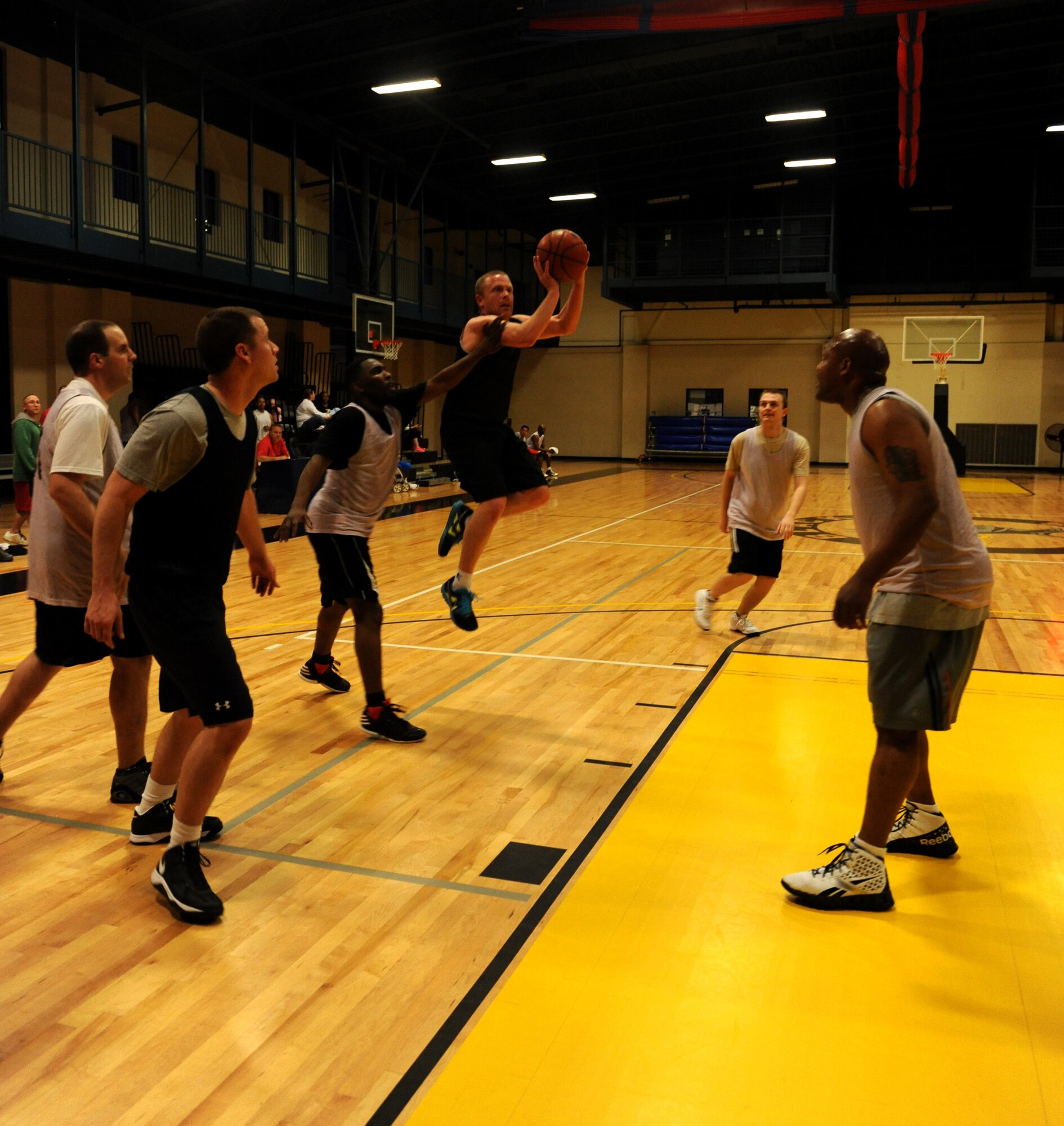 A 19th Communications Squadron basketball player attempts a shot during an intramural game against the 314th Operations Group Feb. 19, 2013, at Little Rock Air Force Base, Ark.  There are several different intramural sports on base such as softball, flag football and volleyball. (U.S. Air Force photo by Airman Scott Poe)