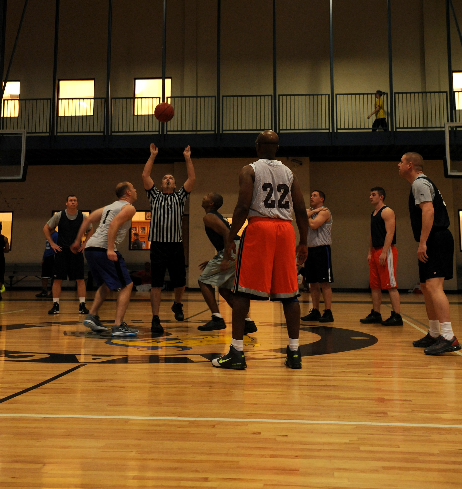 The 314th Operations Group and the 19th Communications Squadron intramural teams tip off at the beginning of a game Feb. 19, 2013, at Little Rock Air Force Base, Ark. There are a total of 14 teams in the intramural base basketball league. (U.S. Air Force photo by Airman Scott Poe)
