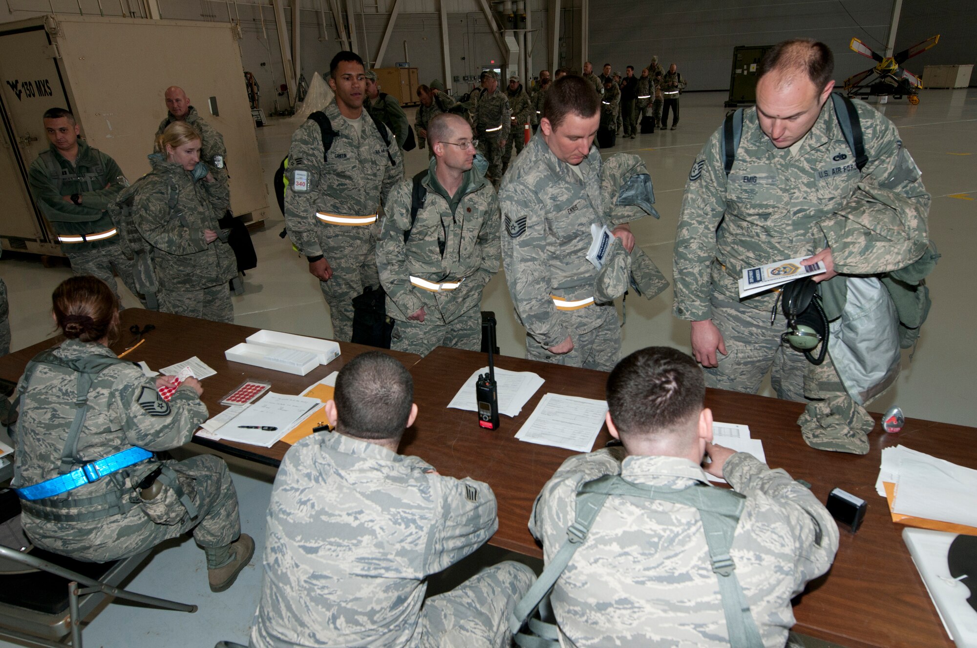 Members of the153rd Airlift Wing in-process during an Operational Readiness Exercise, after arriving at the Mississippi Air National Guard's Combat Readiness Training Center Gulfport in Gulfport, Miss. The 134th Air Expeditionary Wing is comprised of four units: the 153rd Airlift Wing, the 130th Airlift Wing, the 375th Air Mobility Wing and the 11th Wing. The exercise assesses the abilities of the individual units to deploy forces, quickly respond and recover assets during a weeklong exercise conducted and graded by an Exercise Evaluation Team. (U.S. Air Force Photo by Tech. Sgt. Bryan G. Stevens/Released)