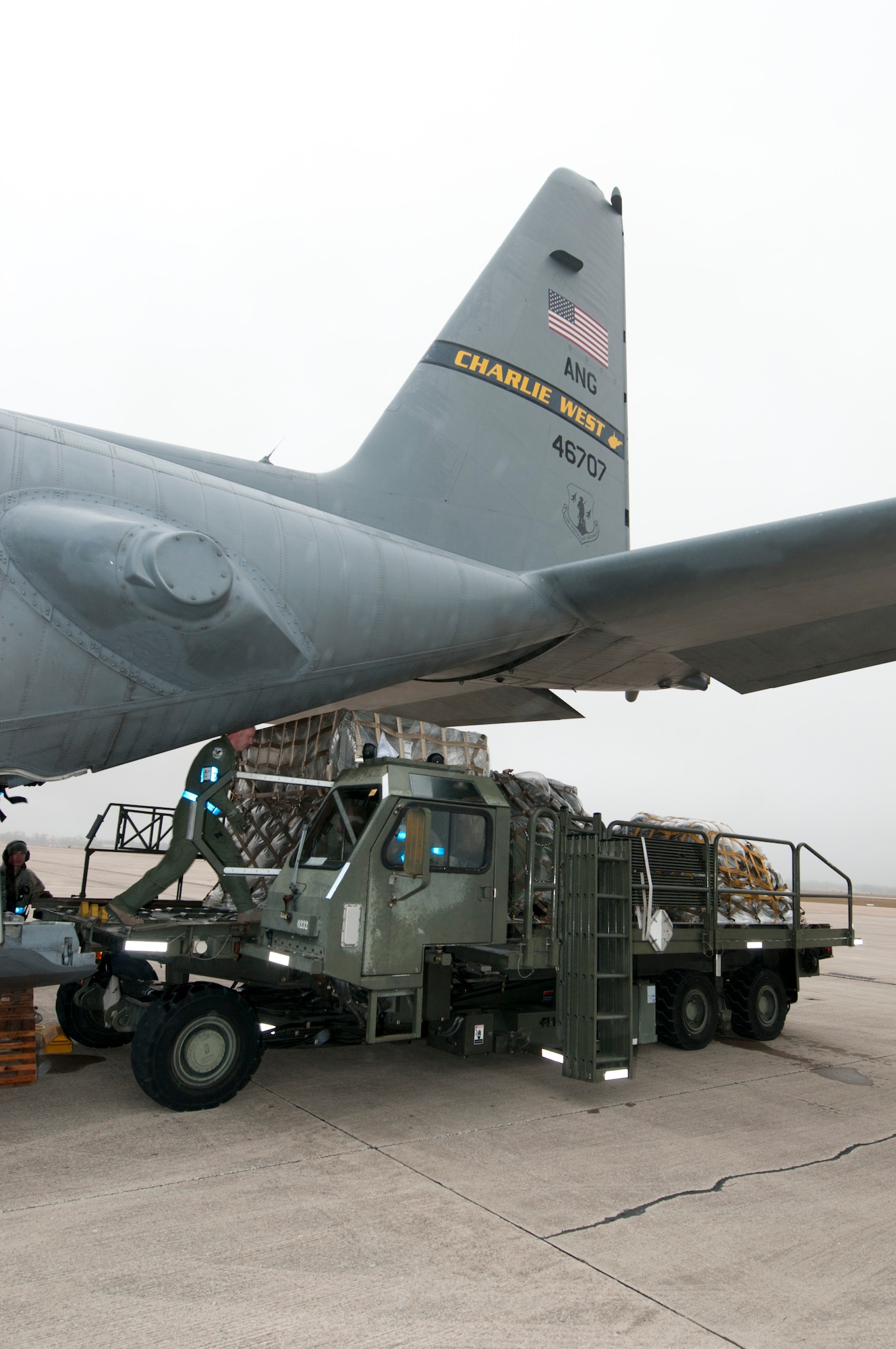 Staff Sgt. Steven Soblet of the 130th Airlift Wing Air National Guard, off-loads pallets from a C-130 Hercules, during Operational Readiness Exercise at the Mississippi Air National Guard's Combat Readiness Training Center Gulfport in Gulfport, Miss. The 134th AEW is comprised of four Units; the 153rd Airlift Wing, the 130th Airlift Wing, the 375th Air Mobility Wing and the 11th Wing. The exercise assesses the abilities of the individual units to deploy forces, quickly respond and recover assets during a weeklong exercise conducted and graded by an Exercise Evaluation Team. (U.S. Air Force Photo by Tech. Sgt. Bryan G. Stevens/Released)