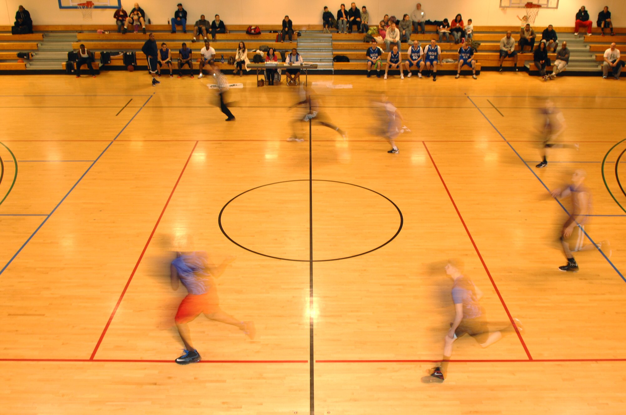 Members of the 100th Logistics Readiness Squadron rush to the other side of the court during an intramural basketball game between the 100th LRS and the 100th Maintenance Operations Squadron Feb. 20, 2013, at the Hardstand Fitness Center on RAF Mildenhall, England. The 100th LRS was victorious over the 100th MOS 45-35. (U.S. Air Force photo by Airman 1st Class Dillon Johnston/Released)
