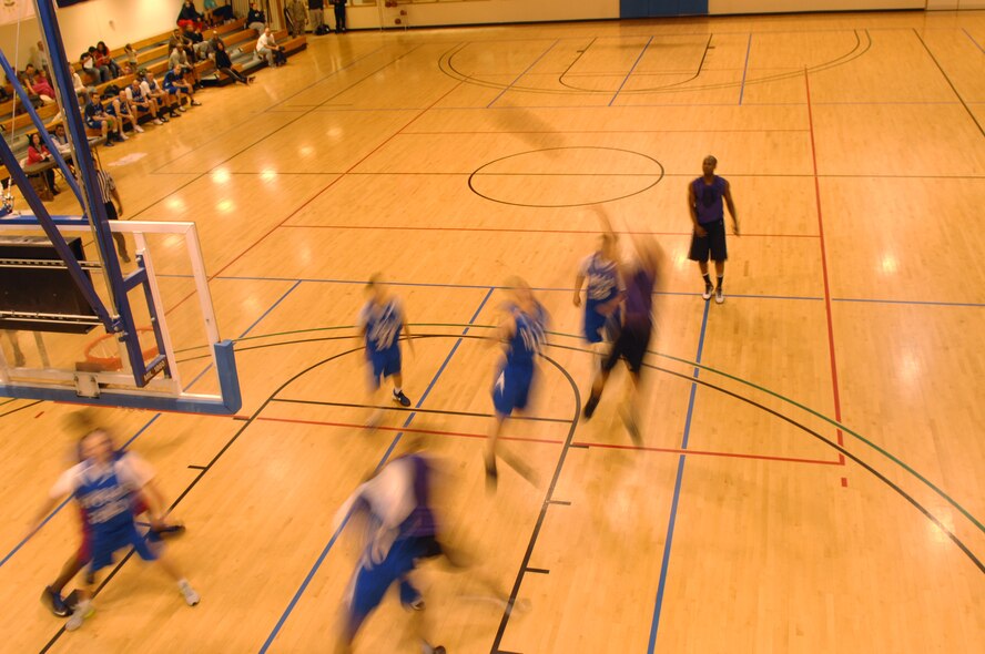 A member of the 100th Logistics Readiness Squadron shoots the ball during an intramural basketball game between the 100th LRS and the 100th Maintenance Operations Squadron Feb. 20, 2013, at the Hardstand Fitness Center on RAF Mildenhall, England. The 100th LRS was victorious over the 100th MOS 45-35. (U.S. Air Force photo by Airman 1st Class Dillon Johnston/Released)
