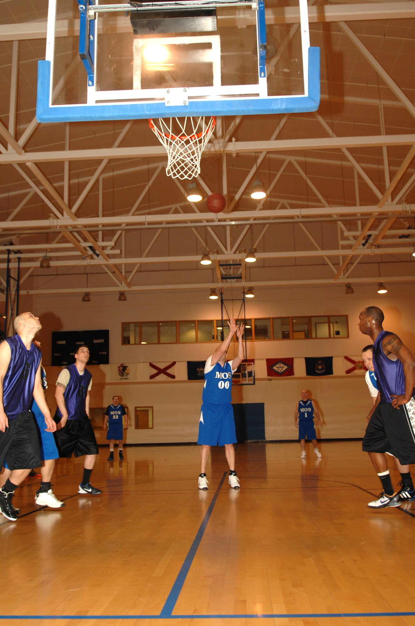 Tech. Sgt. Joseph Ogden, 373rd Training Squadron, Detachment 19 instructor element NCO in charge, from Searsport, Maine, shoots a free-throw during an intramural basketball game between the 100th Logistics Readiness Squadron and the 100th Maintenance Operations Squadron Feb. 20, 2013, at the Hardstand Fitness Center on RAF Mildenhall, England. The 100th LRS was victorious over the 100th MOS 45-35. (U.S. Air Force photo by Airman 1st Class Dillon Johnston/Released)
