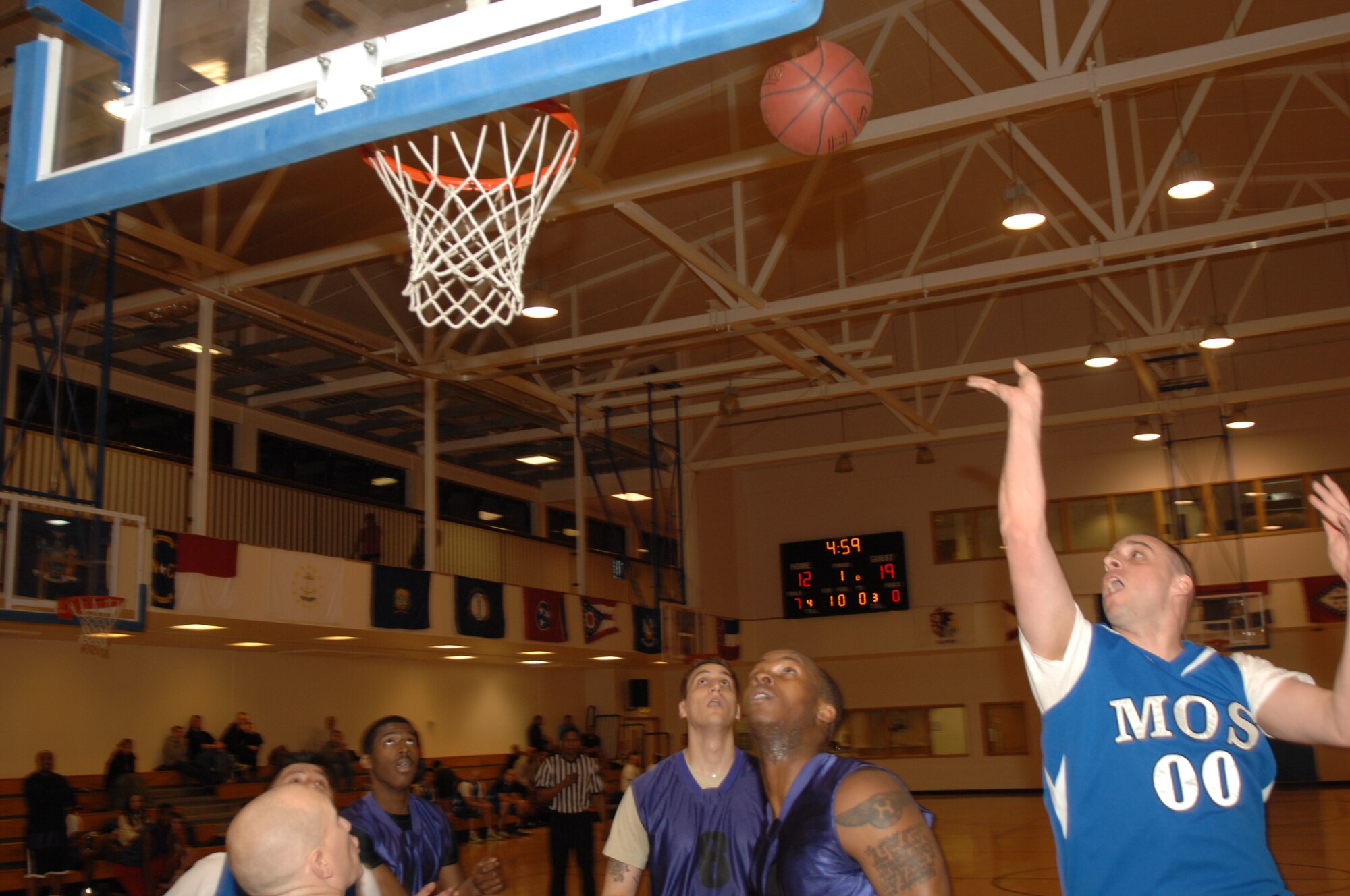 Tech. Sgt. Joseph Ogden, 373rd Training Squadron, Detachment 19 instructor element NCO in charge, from Searsport, Maine, puts up a layup during an intramural basketball game between the 100th Logistics Readiness Squadron and the 100th Maintenance Operations Squadron Feb. 20, 2013, at the Hardstand Fitness Center on RAF Mildenhall, England. The 100th LRS was victorious over the 100th MOS 45-35. (U.S. Air Force photo by Airman 1st Class Dillon Johnston/Released)