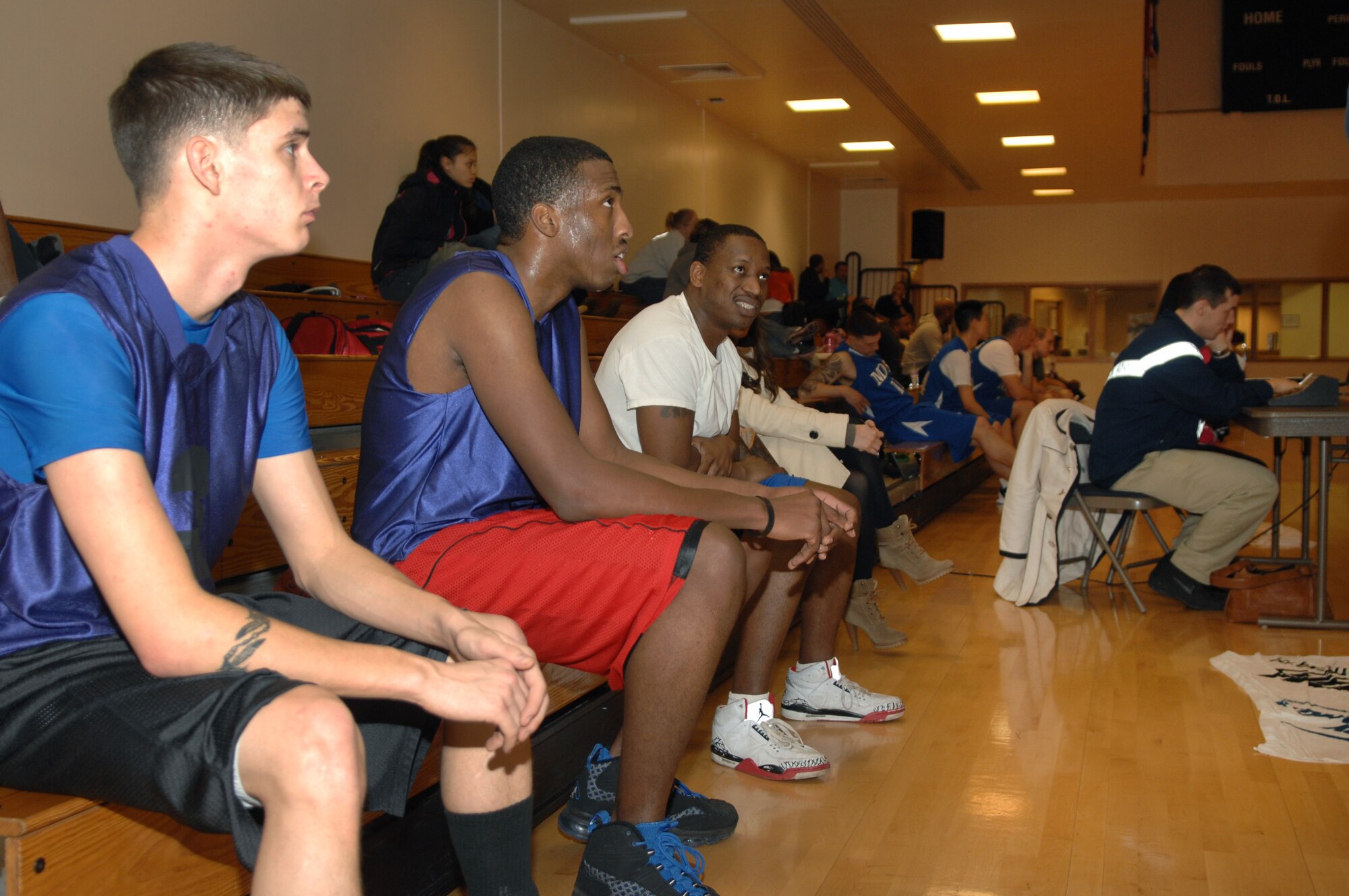 Members of the 100th Logistics Readiness Squadron watch from the sidelines during an intramural basketball game between the 100th LRS and the 100th Maintenance Operations Squadron Feb. 20, 2013, at the Hardstand Fitness Center on RAF Mildenhall, England. The 100th LRS was victorious over the 100th MOS 45-35. (U.S. Air Force photo by Airman 1st Class Dillon Johnston/Released)