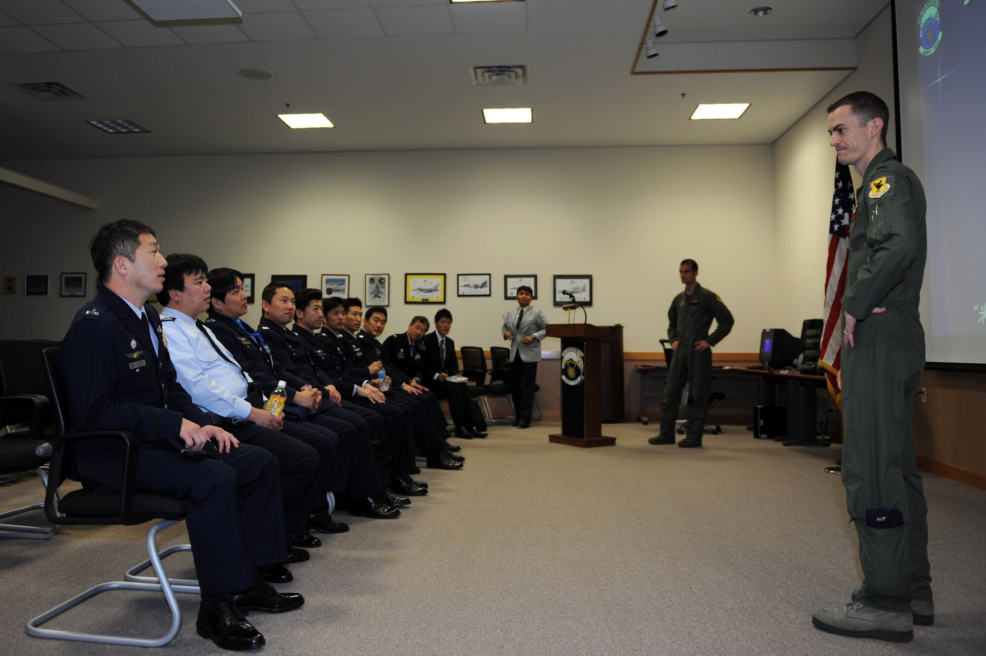 U.S. Air Force 1st Lt. Jacob Belka, 909th Air Refueling Squadron pilot, briefs Japan Air Self-Defense Force officers about the U.S. Air Force KC-135 Stratotanker refueling aircraft on Kadena Air Base, Japan, Feb. 20, 2013. The KC-135 Stratotanker’s principal mission is air refueling, and it is a unique asset that greatly enhances the Air Force’s capability to accomplish its missions of Global Reach and Global Power. It also provides aerial refueling support to aircraft of allied nations. (U.S. Air Force photo/Airman 1st Class Hailey R. Davis)