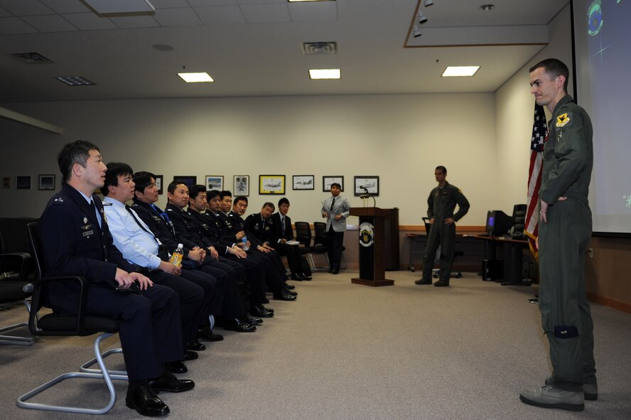 U.S. Air Force 1st Lt. Jacob Belka, 909th Air Refueling Squadron pilot, briefs Japan Air Self-Defense Force officers about the U.S. Air Force KC-135 Stratotanker refueling aircraft on Kadena Air Base, Japan, Feb. 20, 2013. The KC-135 Stratotanker’s principal mission is air refueling, and it is a unique asset that greatly enhances the Air Force’s capability to accomplish its missions of Global Reach and Global Power. It also provides aerial refueling support to aircraft of allied nations. (U.S. Air Force photo/Airman 1st Class Hailey R. Davis)