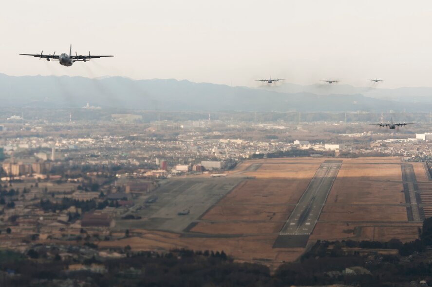 ABOVE YOKOTA AIR BASE, Japan -- C-130 Hercules fly a training mission above Yokota Air Base, Japan, Feb. 21, 2013. Six C-130s flew in formation practicing airlift tactics and procedures. (U.S. Air Force Photo by Osakabe Yasuo)