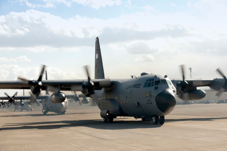 YOKOTA AIR BASE, Japan -- C-130 Hercules aircraft from the 36th Airlift Squadron taxi out  for a mission during an six-ship sortie at Yokota Air Base, Japan, Feb. 21, 2013. The C-130 aircrews demonstrated their airlift capabilities during a readiness week.  (U.S. Air Force photo by Osakabe Yasuo) 