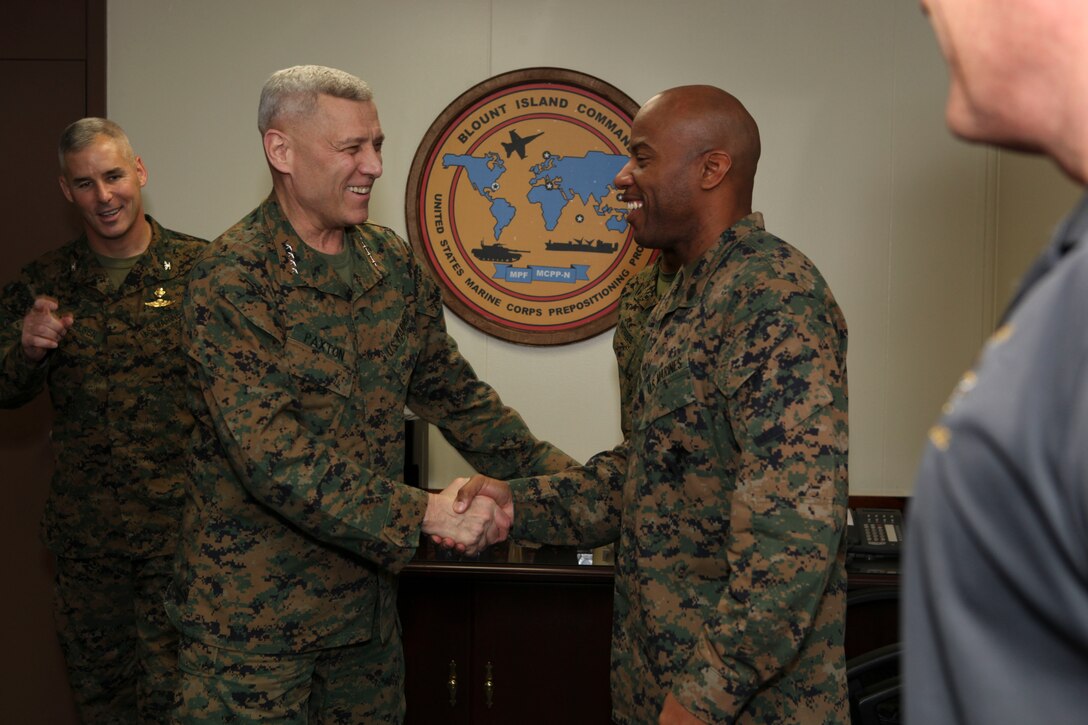 The Assistant Commandant of the Marine Corps, Gen. John M. Paxton, Jr. greets personal during a visit to Marine Corps Support Facility-Blount Island, Jacksonville, FL, Feb. 20, 2013. The trip was part of a larger visit with Marines aboard installations under Marine Corps Logistics Command (LOGCOM). (U.S. Marine Corps photo by Cpl. Tia Dufour/Released)