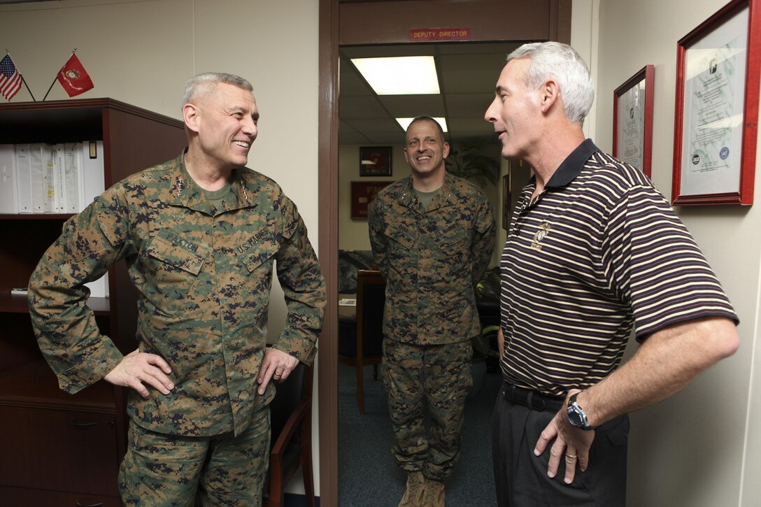 The Assistant Commandant of the Marine Corps, General John M. Paxton, Jr. speaks with the Deputy Director and the Commanding Officer, Col.  while visiting Marine Corps Support Facility-Blount Island, Jacksonville, FL, Feb 20, 2013. (U.S. Marine Corps photo Cpl. Tia Dufour/Released)