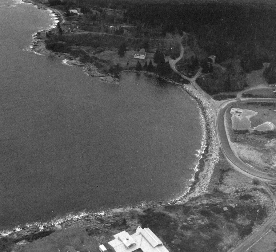 Aerial view of Sand Cove. Sand Cove in Gouldsboro is located SS miles southeast of Bangor and 12 miles east of Bar Harbor. The project site is located on the eastern shore of a narrow strip of land known as the Corea Causeway, which separates Sand Cove and Corea Harbor.
