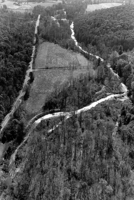 Aerial view of Alford. This project is located along the Green River in Hillsdale, New York, which borders the Massachusetts community of Alford, 43 miles west of Springfield. Although officially in New York State, the project provides protection to Alford and was built by the Corps' New England District. Photograph taken Oct. 1987