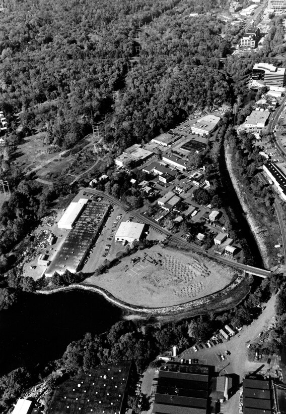 Aerial view of Norwalk LPP. The Norwalk Local Protection Project is located on the Norwalk River, in the vicinity of Perry Avenue in Norwalk, CT. This project safeguards about eight acres of residential and commercial property that had been subjected to frequent flooding. Photo was taken in Oct. 1986.