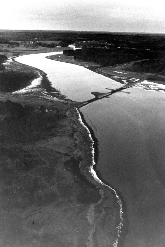 Aerial view of Exeter River Navigation Project. The Exeter River originates in Chester and follows a meandering course eastward for 43 miles before emptying into Great Bay in Newmarket, near the mouth of the Lamprey River and about eight miles southwest of Portsmouth. The Corps' project is on the lower 8.3 miles of the Exeter River, known locally as the Squamscott River, which flows through Exeter, Newfields, Stratham, and Newmarket, NH.  Photo was taken in Dec. 1988.