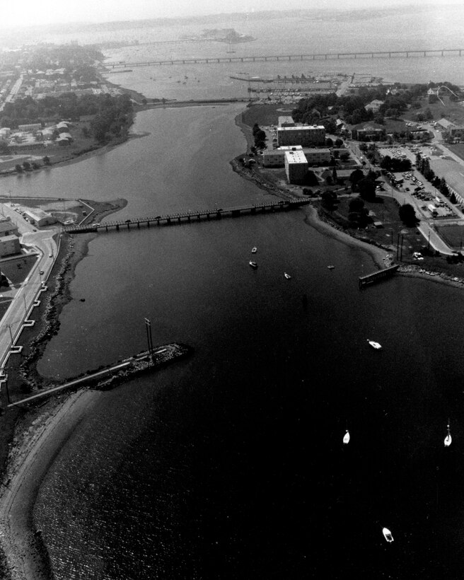 Aerial view of Coasters Harbor Navigation project. Coasters Harbor in Newport is a small, protected harbor situated between Coasters Harbor Island, at the northern end of Newport Harbor, and the mainland. Coasters Harbor Island is located about 0.5 mile south of Coddington Point, and is the base of operations for the U.S. Navy Newport Training Station and the U.S. Naval War College, RI. Photo was taken in Aug. 1988.