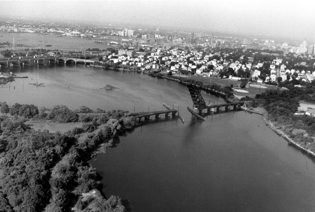 Aerial view of Seekonk Riverr Navigation project. From the natural falls at Pawtucket, the Seekonk River flows about five miles southerly between the cities of Providence and East Providence before emptying into Providence Harbor at India Point, RI.  Photo was taken in Aug. 1988.
