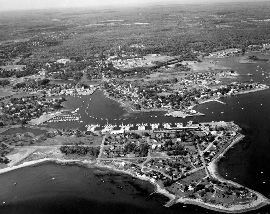 Aerial view ofWickford Harbor Navigation project. Wickford Harbor is located in the Wickford section of North Kingstown in western Narragansett Bay, about two miles southwest of Quonset Point and 17 miles south of Providence. Wickford Harbor consists of an outer harbor and three small coves -- Wickford Cove, Fishing Cove, and Mill Cove, RI.