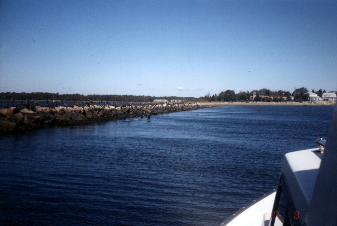 Wickford Harbor. Wickford Harbor is located in the Wickford section of North Kingstown in western Narragansett Bay, about two miles southwest of Quonset Point and 17 miles south of Providence. Wickford Harbor consists of an outer harbor and three small coves -- Wickford Cove, Fishing Cove, and Mill Cove, RI.