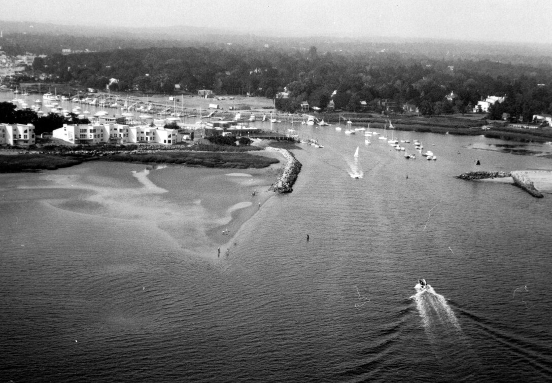 Aerial view of Milford Harbor. Milford Harbor is located at the mouth of the Wepawaug River along the Milford shorefront in CT.  Photo was taken Aug. 1981.