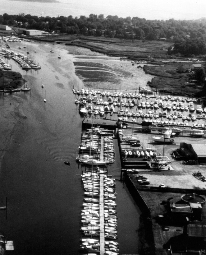 Aerial view of Milford Harbor. Milford Harbor is located at the mouth of the Wepawaug River along the Milford shorefront in CT.  Photo was taken in Aug. 1981. 