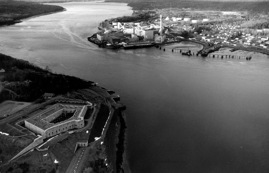 Aerial view of Bucksport Harbor. Bucksport Harbor in Bucksport is located on the Penobscot River, about nine miles upstream of Penobscot Bay. The Bucksport waterfront is located on Eastern Channel, opposite Verona Island and historic Fort Knox, ME.  Photograph taken in Dec. 1987.