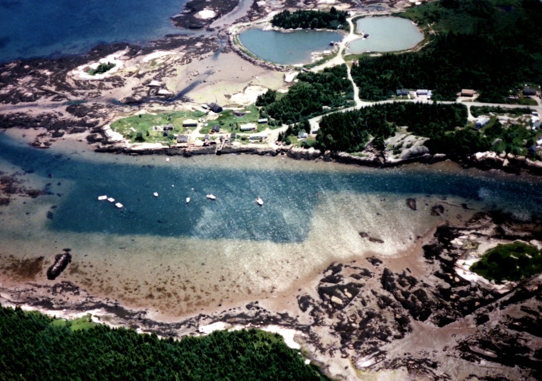 Aerial view of Pig Island Gut. Pig Island Gut in Beals is the narrow passage between Pig Island and Great Wass Island, about one mile southeast of Jonesport and 30 miles east of Bar Harbor, ME.