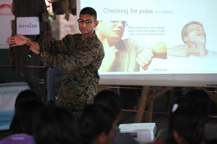 Navy Lt. Ankush Jain, unit surgeon for the 31st Marine Expeditionary Unit and a native of Gaithersburg, Md., demonstrates the location on the wrist to check for a pulse during a subject matter expert exchange at the Wat Ta Kraw community center here, Feb. 14. The event, part of exercise Cobra Gold 2013, is designed to share medical practices with civilian healthcare providers. Medical personnel of the 31st MEU exchanged medical training procedures with their Royal Thai Army counterparts. Cobra Gold is an annual exercise that includes numerous multilateral events ranging from amphibious assaults to non-combatant evacuation operations. The training aims to improve interoperability between the United States, the Kingdom of Thailand, and many other participating countries. The 31st MEU is the only continuously forward-deployed MEU and is the Marine Corps’ force in readiness in the Asia-Pacific region.