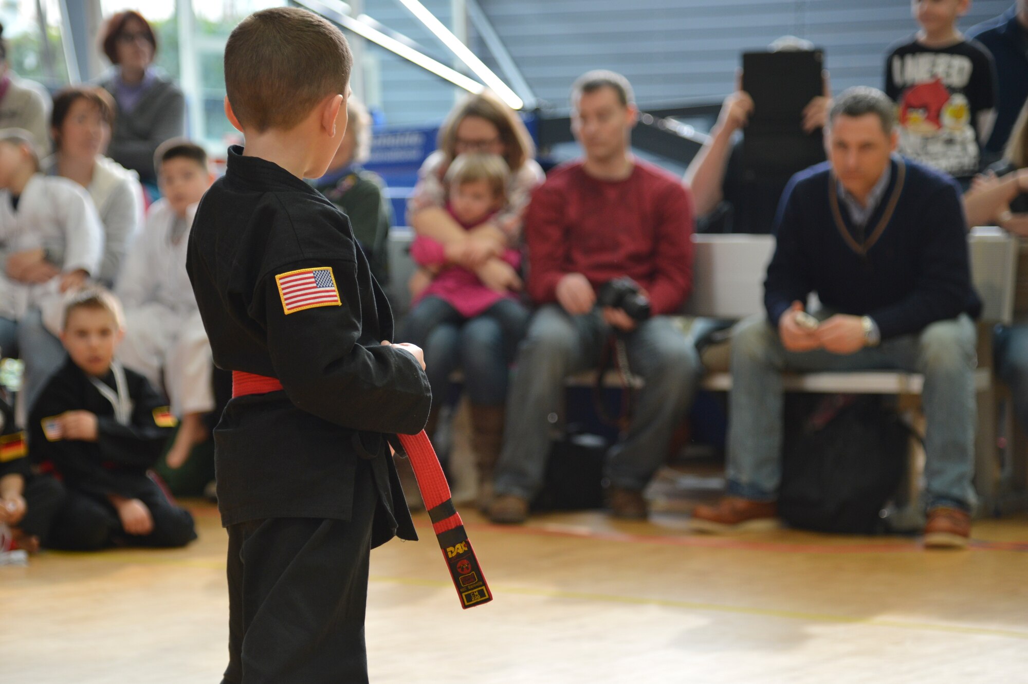 Lucas Wilson, 7, son of Staff Sgt. Micah Wilson, 721st Aircraft Maintenance Squadron quality insurance inspector, gives a martial art demonstration during the 13th annual U.S. Air Forces in Europe and Air Forces Africa Martial Arts Tournament on Ramstein Air Base, Germany, Feb. 23, 2013. The USAFE-AFAFRICA Martial Arts Tournament is a way for all participants ages 3 to 18 to test their martial art skills against their peers. (U.S. Air Force photo/Airman 1st Class Jordan Castelan)