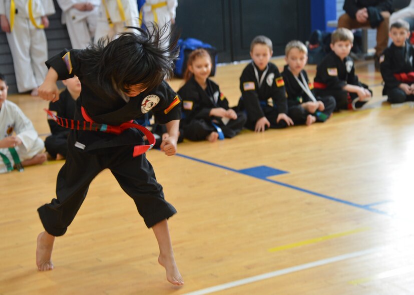 Jaeden Hose, 8, son of Master Sgt. Mathew Hose, 521st Air Mobility Operations Wing Air Force Smart Operations for the 21st century program manager, gives a martial art demonstration during the 13th annual U.S. Air Forces in Europe and Air Forces Africa Martial Arts Tournament on Ramstein Air Base, Germany, Feb. 23, 2013. The USAFE-AFAFRICA Martial Arts Tournament is a way for all participants ages 3 to 18 to test their martial art skills against their peers. (U.S. Air Force photo/Airman 1st Class Jordan Castelan)