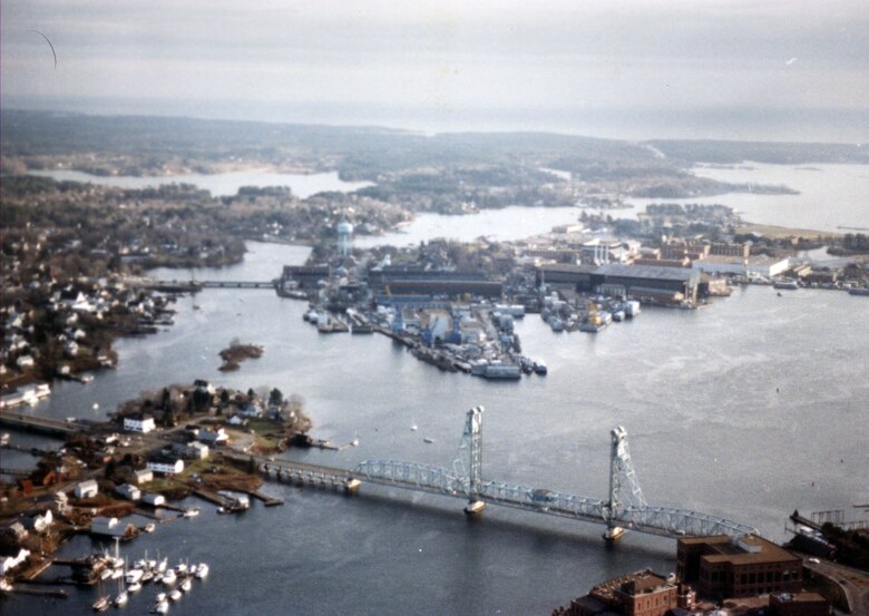 Aerial view of Portsmouth Harbor. Portsmouth Harbor is located on the Piscataqua River, which makes up a portion of the Maine-New Hampshire border. Portsmouth Harbor stretches across the communities of Kittery and Eliot, Maine, and Portsmouth, Newington, and New Castle, New Hampshire.