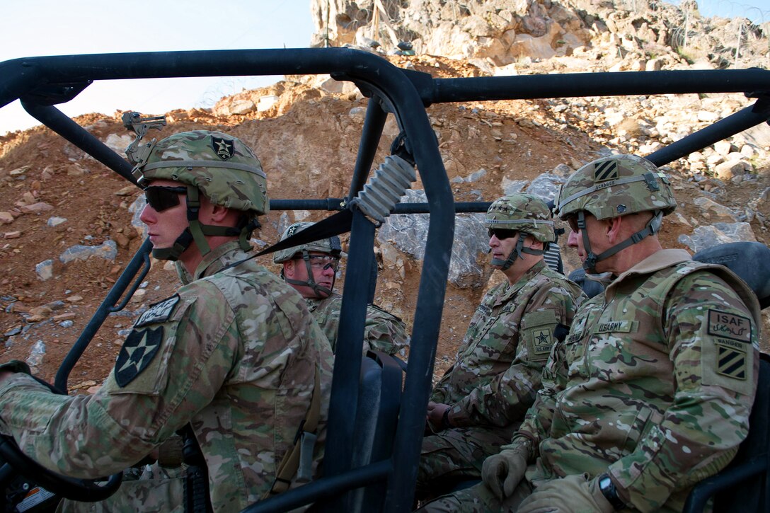 U.S. Army Col. Michael Getchell, far left, U.S. Army Chief of Staff Gen. Ray Odierno and U.S. Brig. Gen. Christopher P. Hughes, right, Deputy Commanding General - Maneuver, 3rd Infantry Division, ride in an all-terrain-vehicle on Forward Operation Bases Masum Ghar, Afghanistan, Feb. 22, 2013. Getchell is the commander, 2nd Infantry Division's 4th Stryker Brigade Combat Team.