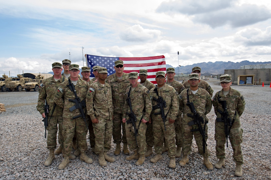U.S. Army Chief of Staff Gen. Ray Odierno poses for a group photo with soldiers that just re-enlisted on Forward Operation Base Frontenac, Afghanistan, Feb. 22, 2013.