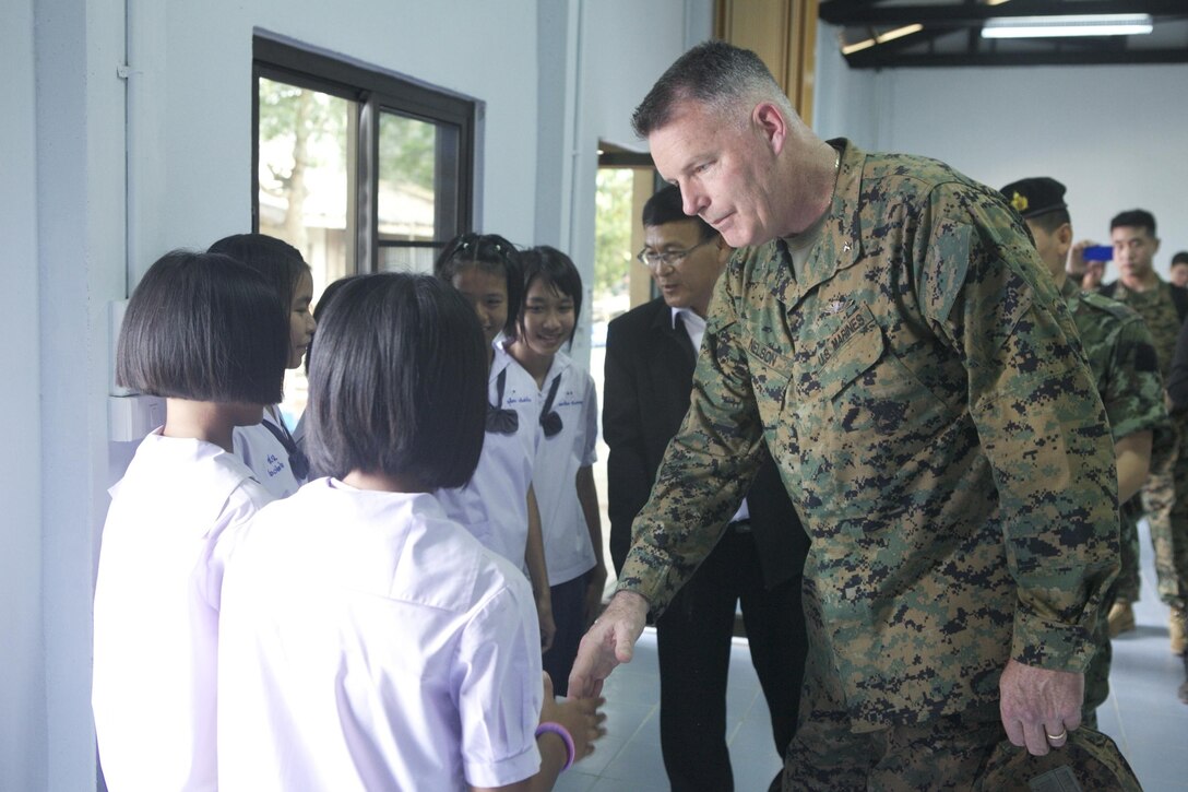 Brig. Gen. Niel E. Nelson speaks to Thai students after participating in the dedication of Ban Hun Wang Ta Krang elementary school’s new secondary facility built by U.S. and Thai Marines in Phitsanulok province, Kingdom of Thailand, Feb. 20 as a part of exercise Cobra Gold 2013. CG 13, in its 32nd iteration, is the largest multinational exercise in the Asia-Pacific region and demonstrates commitment to building interoperability with participating nations and to supporting peace and stability in the region. Nelson is the commanding general of 3rd Marine Logistics Group, III Marine Expeditionary Force.