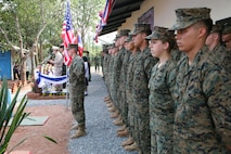 U.S. Marines stand in formation beside their Royal Thai counterparts Feb. 20 during a dedication ceremony for the new building constructed at Ban Kuad Nam Man School, Chat Trakarn District, Phitsanulok province, Kingdom of Thailand, as part of Exercise Cobra Gold 2013. Thai service members are with the 302nd Engineer Battalion, Royal Thai Army. The Marines are with 9th Engineer Support Battalion, 3rd Marine Logistics Group, III Marine Expeditionary Force. Exercise Cobra Gold includes humanitarian and civic assistance projects, a staff exercise and field training exercises. Joint and multinational training is vital to maintaining the readiness and interoperability of all participating military forces.