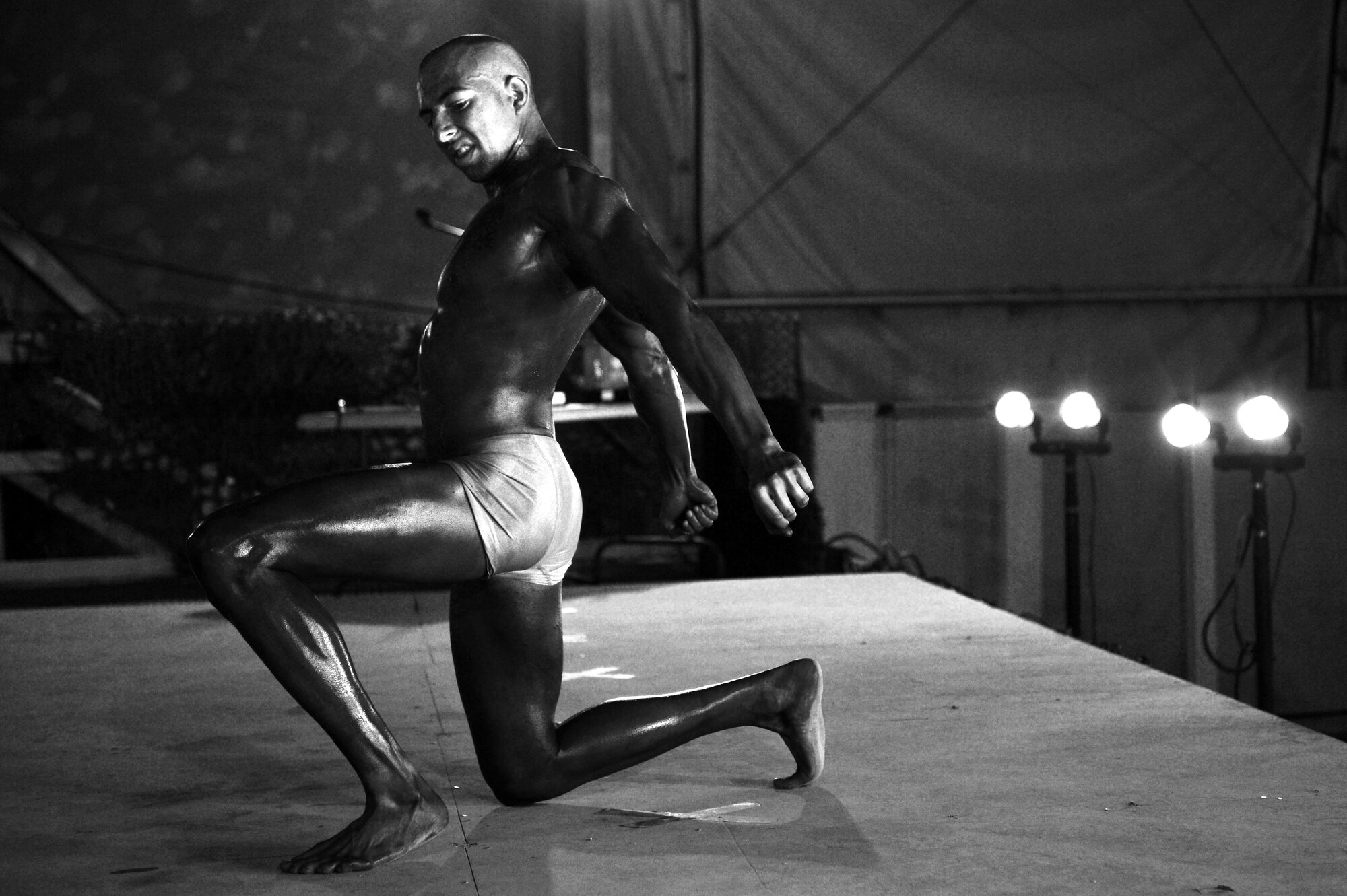 Staff Sgt. Adam Nicola, 455th Expeditionary Communication Squadron client support administrator, participates in a bodybuilding competition at Bagram Airfield, Afghanistan, Feb. 16, 2013.  Nicola, a first time competitor, placed third in the men’s division.  (U.S. Air Force photo/Senior Airman Chris Willis)