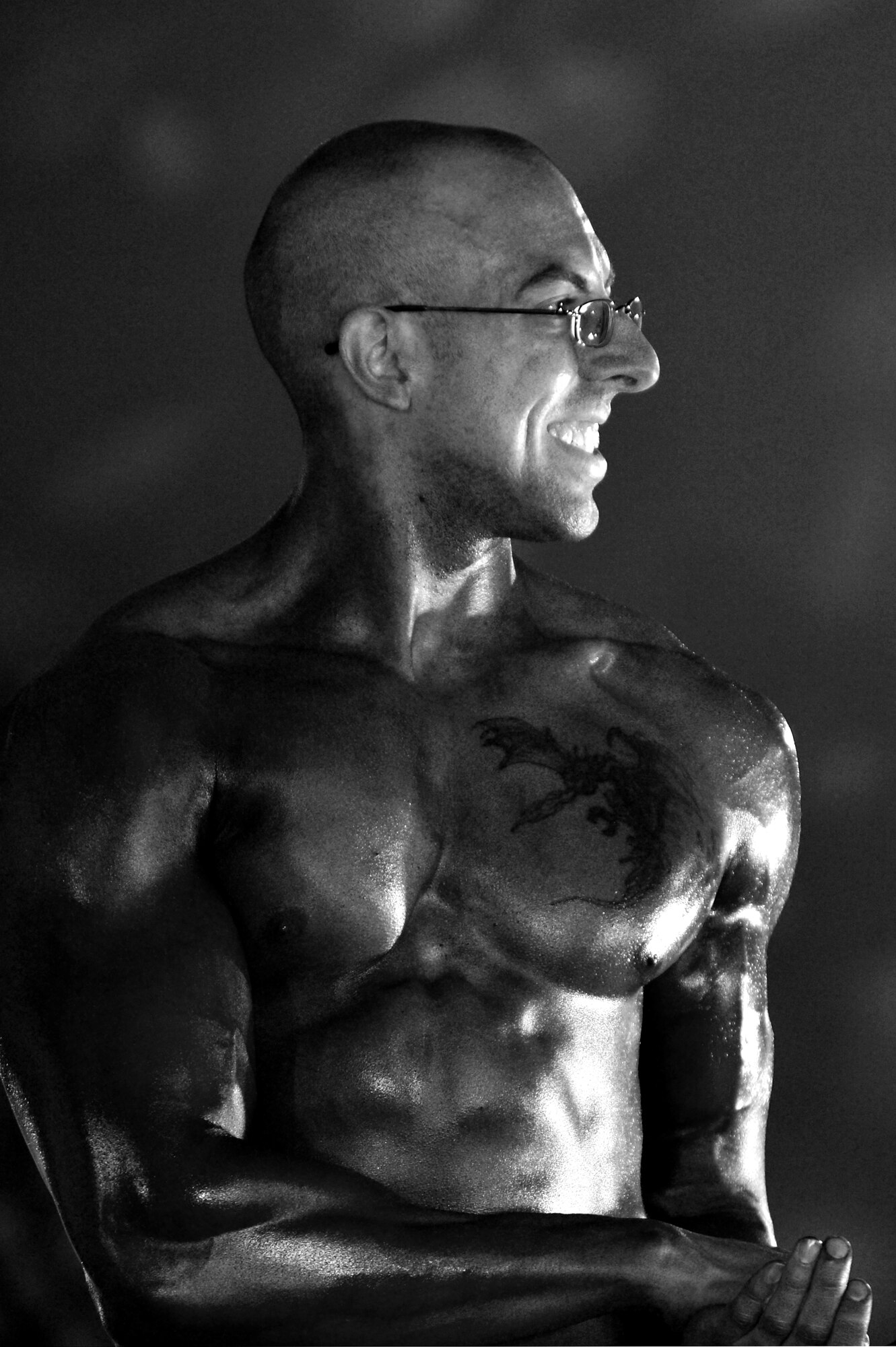 Staff Sgt. Adam Nicola, 455th Expeditionary Communication Squadron client support administrator, participates in a bodybuilding competition at Bagram Airfield, Afghanistan, Feb. 16, 2013.  Nicola, a first time competitor, placed third in the men’s division.  (U.S. Air Force photo/Senior Airman Chris Willis)