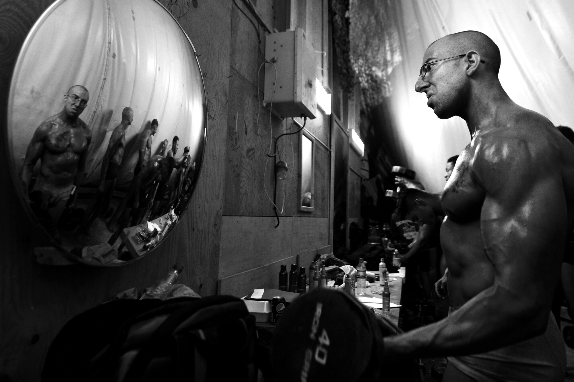 Staff Sgt. Adam Nicola, 455th Expeditionary Communication Squadron client support administrator, participates in a bodybuilding competition at Bagram Airfield, Afghanistan, Feb. 16, 2013.  Nicola, a first time competitor, placed third in the men’s division.  (U.S. Air Force photo/Senior Airman Chris Willis)