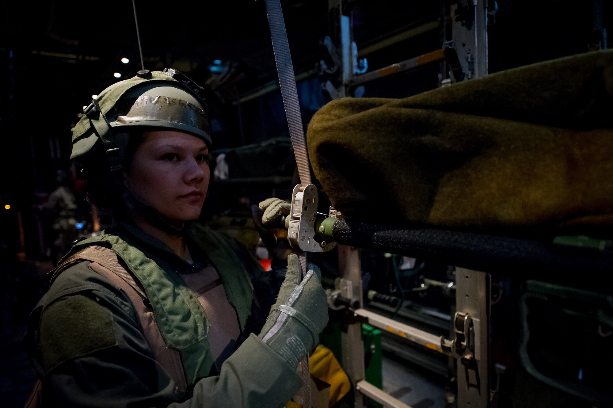 U.S. Air Force Staff Sgt. Christine Nelson, 18th Aeromedical Evacuation Squadron medical technician, Kadena Air Base, Japan, waits to receive a simulated patient on board a C-130 Hercules aircraft in Alexandria, La., Feb. 22, 2013, in support of Joint Readiness Training Center aeromedical evacuation training. Service members at JRTC 13-04 are educated in combat patient care and aeromedical evacuation in a simulated combat environment. (U.S. Air Force photo by Tech. Sgt. John R. Nimmo Sr.)